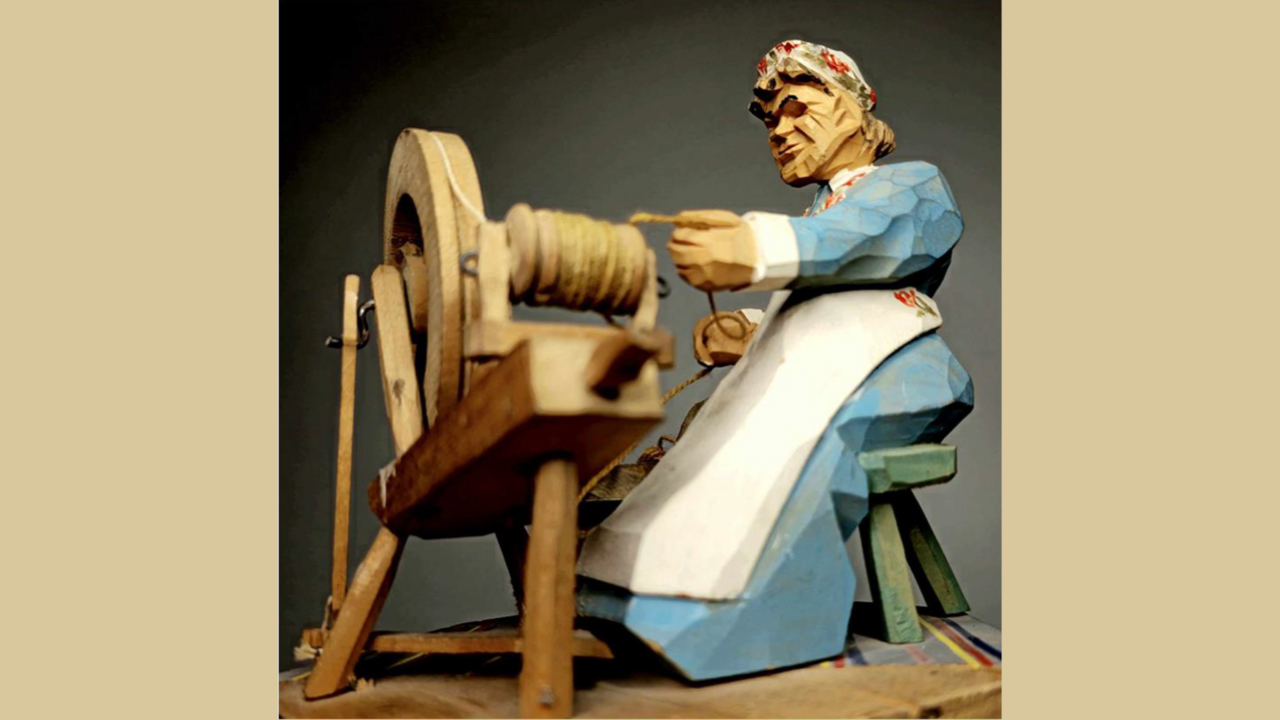 Figur som spinner garn